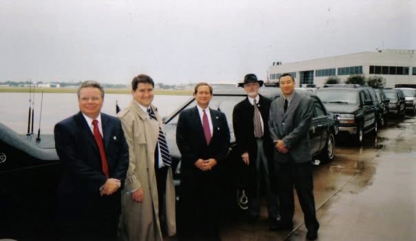 Cory Cox on the tarmac with the George W. Bush Presidential Motorcade